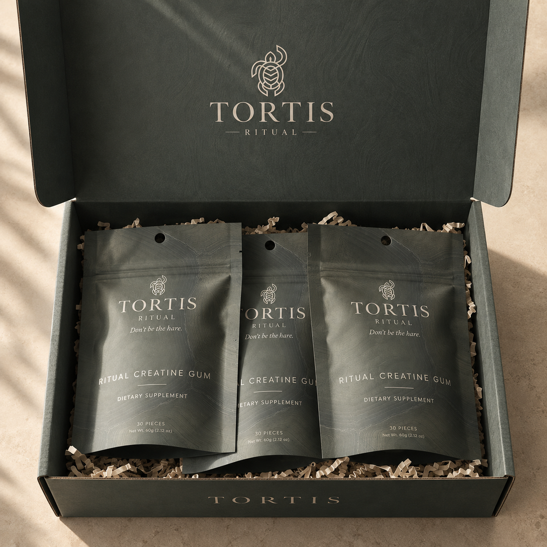 Three TORTIS Ritual creatine gum pouches presented in a box